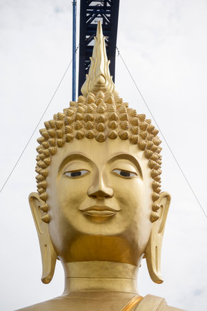 the buddha of the Wat suphatbophit near the city of Buriram in the province of Buri Ram in Isan in Northeast thailand.  Thailand, Buriram, November, 2017のeditorial素材