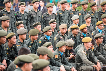 Thai army people at the tradititional Longboat Race at the Mun river of the town of Satuek north of the city Buri Ram in Isan in Northeast thailand.  Thailand, Buriram, November, 2017のeditorial素材