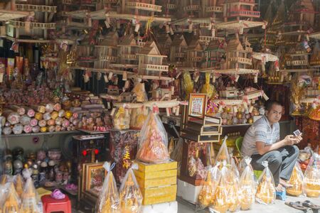 a shop with spirit houses at the central market or Psar Thmei market in the city of Phnom Penh of Cambodia.  Cambodia, Phnom Penh, November, 2017,のeditorial素材
