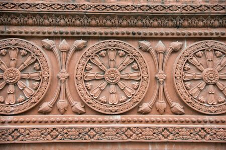 Decoration at the Wall of the Wat Ounalom at the Tonle Sap River in the city of Phnom Penh of Cambodia.  Cambodia, Phnom Penh, November, 2017,のeditorial素材