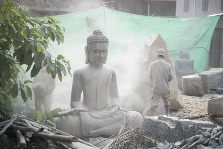 a Buddha carving factory at the Village of Kakaoh east of the city of Kampong Thom of Cambodia.  Cambodia, Kampong Thom, November, 2017,のeditorial素材