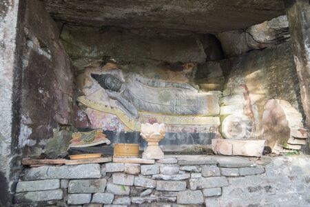 a carved sandstone Buddha Image at the Phnom Santuk Temple near of the city of Kampong Thom of Cambodia.  Cambodia, Kampong Thom, November, 2017,のeditorial素材