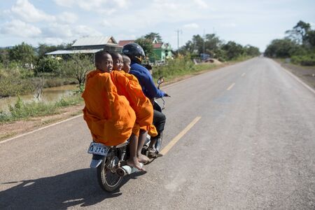 a motorbike on a road near the town of Sra Em in the province of Preah Vihear in Northwest Cambodia.  Cambodia, Sra Em, November, 2017,のeditorial素材