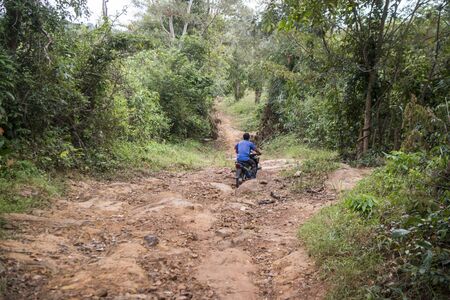 the road to the house of Pol Pot in the jungle on the Dangrek Mountain range near the town of Choam and north of the Town of Anlong Veng in the province of Oddar Meanchey in Northwaest Cambodia.  Cambodia, Anlong Veng, November, 2017,のeditorial素材