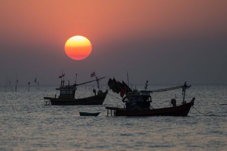 a sunset with fishing boats at the Bang Saen Beach at the Town of Bangsaen in the Provinz Chonburi in Thailand.  Thailand, Bangsaen, November, 2018のeditorial素材