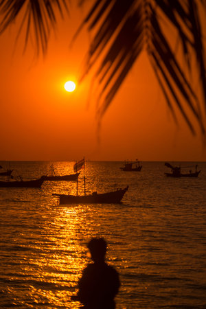 a sunset with fishing boats at the Bang Saen Beach at the Town of Bangsaen in the Provinz Chonburi in Thailand.  Thailand, Bangsaen, November, 2018のeditorial素材