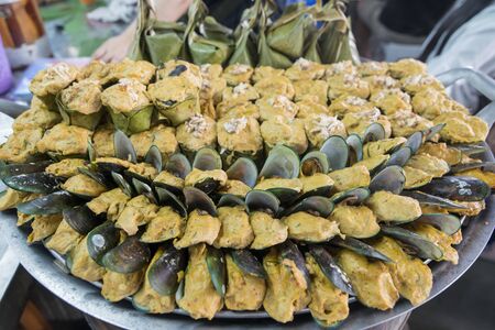Mussels and seafood at the city Market in the Town of Bangsaen in the Provinz Chonburi in Thailand.  Thailand, Bangsaen, November, 2018のeditorial素材