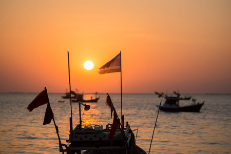 a sunset with fishing boats at the Bang Saen Beach at the Town of Bangsaen in the Provinz Chonburi in Thailand.  Thailand, Bangsaen, November, 2018のeditorial素材