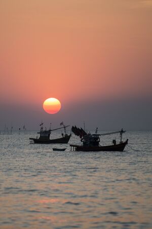 a sunset with fishing boats at the Bang Saen Beach at the Town of Bangsaen in the Provinz Chonburi in Thailand.  Thailand, Bangsaen, November, 2018のeditorial素材