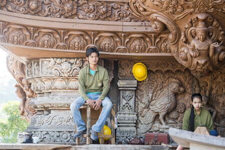workers from Myanmar on wood carving work for the Wood Sanctuary of Truth Temple in the city of Pattaya in the Provinz Chonburi in Thailand.  Thailand, Pattaya, November, 2018のeditorial素材