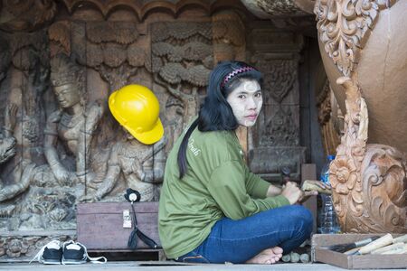 workers from Myanmar on wood carving work for the Wood Sanctuary of Truth Temple in the city of Pattaya in the Provinz Chonburi in Thailand.  Thailand, Pattaya, November, 2018のeditorial素材