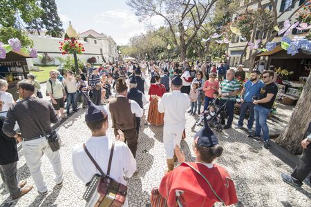 a traditonal madeira folklore music group s at the Festa da Flor or Spring Flower Festival in the city of Funchal on the Island of Madeira in the Atlantic Ocean of Portugal.  Madeira, Funchal, April, 2018のeditorial素材