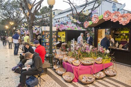 the flower market and market street at the avenida Arriaga at the Festa da Flor or Spring Flower Festival in the city of Funchal on the Island of Madeira in the Atlantic Ocean of Portugal.  Madeira, Funchal, April, 2018のeditorial素材