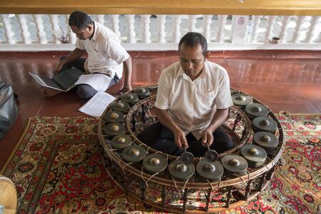 traditional khmer music at the Preah Angchek or Preah Ang Chorm Shrine in the city of Siem Reap in northwest of Cambodia.   Siem Reap, Cambodia, November 2018のeditorial素材
