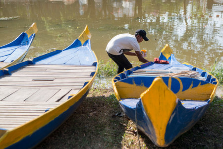 traditional wood Boat at the Siem Reap River in the old Town in the city of Siem Reap in northwest...