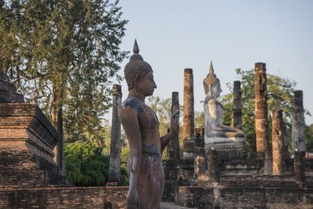 a Buddha with a stupa at the Wat Sa Si Temple at the Historical Park in Sukhothai in the Provinz Sukhothai in Thailand.   Thailand, Sukhothai, November, 2018のeditorial素材