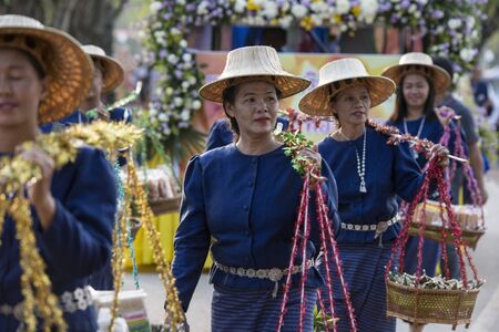 traditional dresst thai people at the Loy Krathong Festival in the Historical Park in Sukhothai in the Provinz Sukhothai in Thailand.   Thailand, Sukhothai, November, 2018のeditorial素材