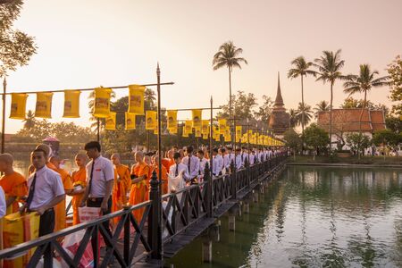 a buddhism Monk ceremony at the Loy Krathong Festival in the Historical Park in Sukhothai in the Provinz Sukhothai in Thailand.   Thailand, Sukhothai, November, 2018のeditorial素材