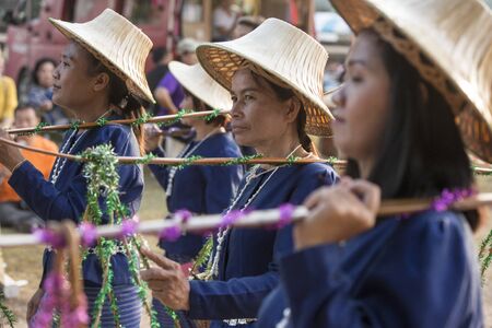 traditional dresst thai people at the Loy Krathong Festival in the Historical Park in Sukhothai in the Provinz Sukhothai in Thailand.   Thailand, Sukhothai, November, 2018のeditorial素材