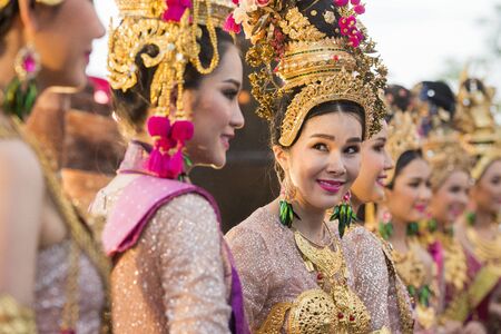 traditional dresst thai women at the Loy Krathong Festival in the Historical Park in Sukhothai in the Provinz Sukhothai in Thailand.   Thailand, Sukhothai, November, 2018のeditorial素材