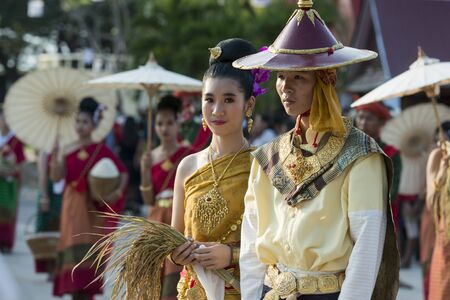 traditional dresst thai people at the Loy Krathong Festival in the Historical Park in Sukhothai in the Provinz Sukhothai in Thailand.   Thailand, Sukhothai, November, 2018のeditorial素材