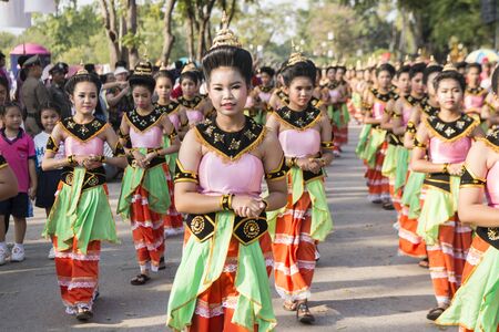 traditional dresst thai women at the Loy Krathong Festival in the Historical Park in Sukhothai in the Provinz Sukhothai in Thailand.   Thailand, Sukhothai, November, 2018のeditorial素材