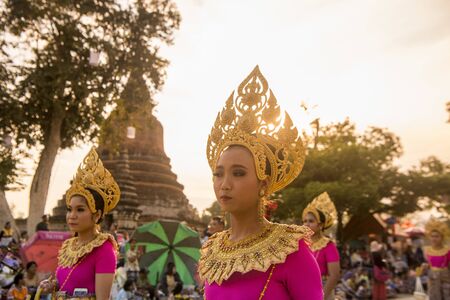 traditional dresst thai people at the Loy Krathong Festival in the Historical Park in Sukhothai in the Provinz Sukhothai in Thailand.   Thailand, Sukhothai, November, 2018のeditorial素材