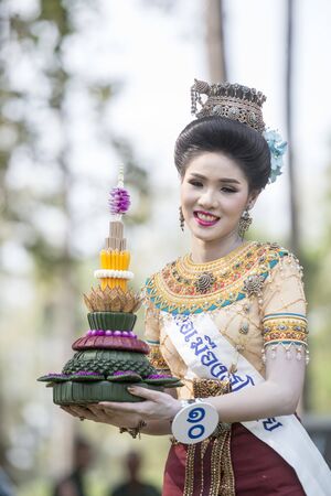 traditional dresst thai people at the Loy Krathong Festival in the Historical Park in Sukhothai in the Provinz Sukhothai in Thailand.   Thailand, Sukhothai, November, 2018のeditorial素材