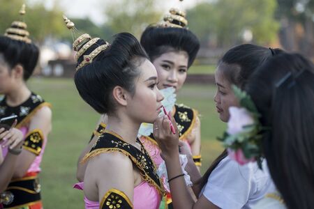 traditional dresst thai people at the Loy Krathong Festival in the Historical Park in Sukhothai in the Provinz Sukhothai in Thailand.   Thailand, Sukhothai, November, 2018のeditorial素材