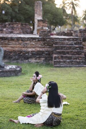 traditional dresst thai people at the Loy Krathong Festival in the Historical Park in Sukhothai in the Provinz Sukhothai in Thailand.   Thailand, Sukhothai, November, 2018のeditorial素材
