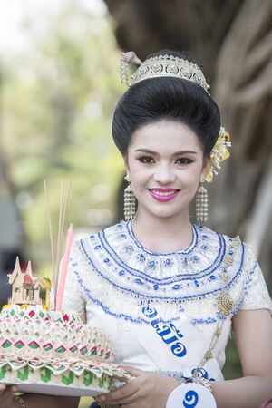 traditional dresst thai women at the Loy Krathong Festival in the Historical Park in Sukhothai in the Provinz Sukhothai in Thailand.   Thailand, Sukhothai, November, 2018のeditorial素材