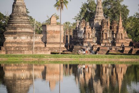 the Wat Mahathat Temple at the Historical Park in Sukhothai in the Provinz Sukhothai in Thailand.   Thailand, Sukhothai, November, 2018のeditorial素材