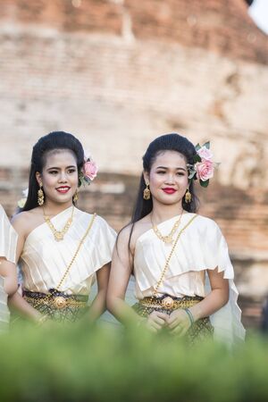 traditional dresst thai people at the Loy Krathong Festival in the Historical Park in Sukhothai in the Provinz Sukhothai in Thailand.   Thailand, Sukhothai, November, 2018のeditorial素材