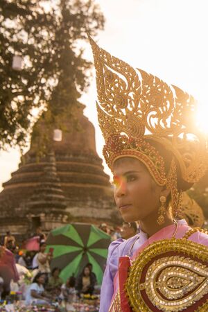 traditional dresst thai people at the Loy Krathong Festival in the Historical Park in Sukhothai in the Provinz Sukhothai in Thailand.   Thailand, Sukhothai, November, 2018のeditorial素材