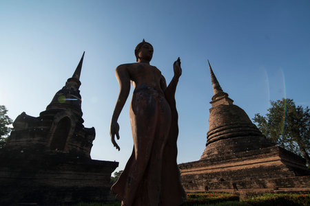 a Buddha with a stupa at the Wat Sa Si Temple at the Historical Park in Sukhothai in the Provinz Sukhothai in Thailand.   Thailand, Sukhothai, November, 2018のeditorial素材