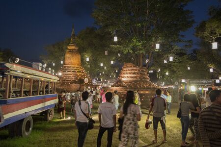 people at the Loy Krathong Festival in the Historical Park in Sukhothai in the Provinz Sukhothai in Thailand.   Thailand, Sukhothai, November, 2018のeditorial素材