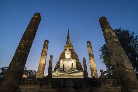 a Buddha with a stupa at the Wat Sa Si Temple at the Historical Park in Sukhothai in the Provinz Sukhothai in Thailand.   Thailand, Sukhothai, November, 2018のeditorial素材