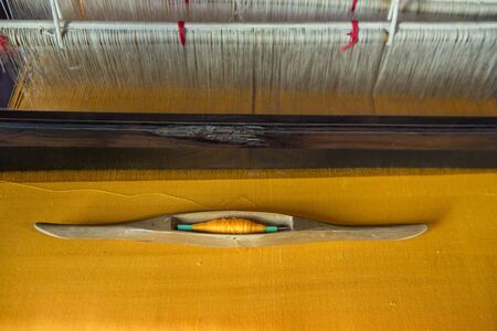 silk production atthe Wood Temple of Wat Jom Sawan in the old Town the city centre of Phrae in the north of Thailand.  Thailand, Phrae November, 2018.のeditorial素材