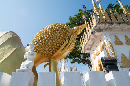 a reclining Buddha at Wat Pong Sunan Temple in the city of  Phrae in the north of Thailand. ...
