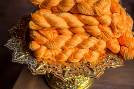 silk production atthe Wood Temple of Wat Jom Sawan in the old Town the city centre of Phrae in the...