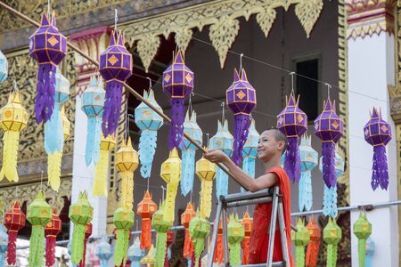 a monk at preparation for the Loy Krathong festival at Wat Pong Sunan Temple in the city of  Phrae in the north of Thailand.  Thailand, Phrae November, 2018.のeditorial素材
