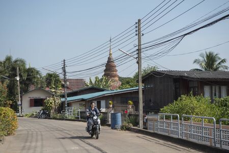 a road in the city centre of Phrae in the north of Thailand.  Thailand, Phrae November, 2018.のeditorial素材