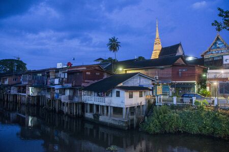 The wat Bot at the waterfront at of Chanthaboon on the Mae Nam Chanthaburi River in old town of the city of  Chanthaburi in the north of Thailand.  Thailand, Chanthaburi, November, 2018.のeditorial素材