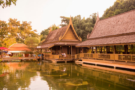 a traditional thai woodhouse with garden at the Maenam river in the city of  Phitsanulok in the...