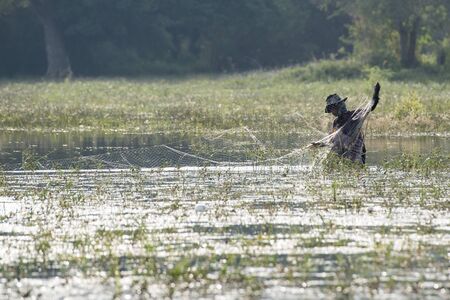 a Fishing man at the Kamping Pouy Lake near the city of Battambang in Cambodia.  Cambodia, Battambang, November, 2018のeditorial素材