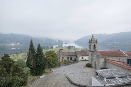a church in the landscape on the Douro river at the town of Alpendurada, east of Porto in Portugal in Europe.  Portugal, Regua, April, 2019のeditorial素材