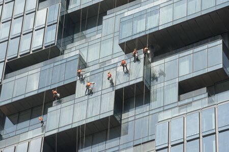 a team of high-rise builging cleaner at work at the Maha Nakhon Building in Silom in the city of Bangkok in Thailand in Southest Asia.  Thailand, Bangkok, November, 2019のeditorial素材