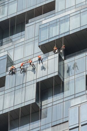 a team of high-rise builging cleaner at work at the Maha Nakhon Building in Silom in the city of Bangkok in Thailand in Southest Asia.  Thailand, Bangkok, November, 2019のeditorial素材