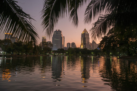 The Lumphini Park with the Skyline in the city of Bangkok in Thailand in Southest Asia.  Thailand,...