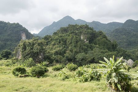 Landscape at the entrance of the Tham Luang cave near the town of Mae Sai on the Border to Myanmar in the Chiang Rai Province in North Thailand.   Thailand, Mae Sai, November, 2019のeditorial素材